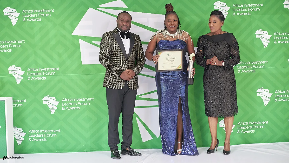 Three people presenting a certificate and trophy in front of an Africa Investment Leaders Forum & Awards backdrop.