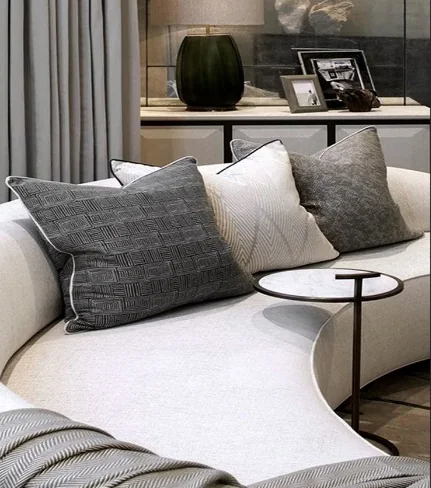 Living room design with neutral upholstery and textured cushions